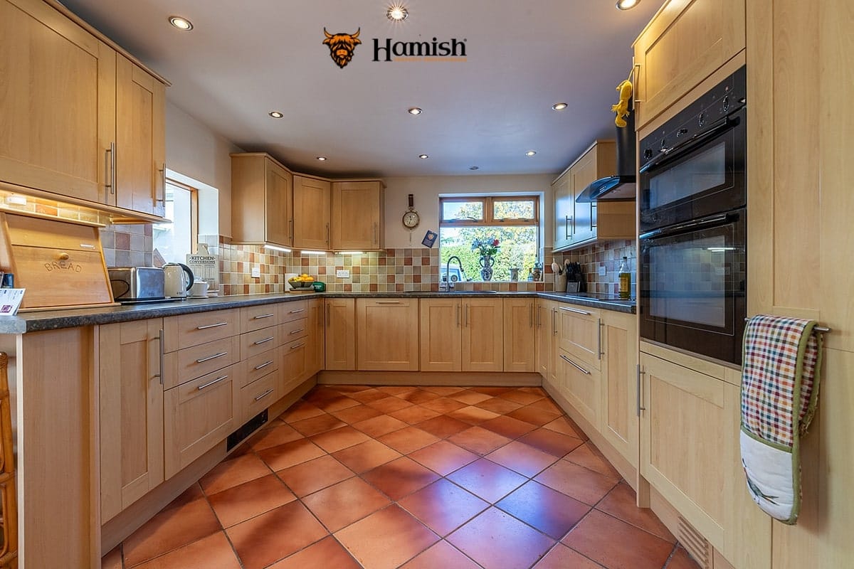 LUXURY STYLING SIMPLE HACKS TO MAKE ROOMS FEEL MORE EXPENSIVE 3 Luxury kitchen with organised countertops and stylish décor